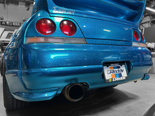 Load image into Gallery viewer, GReddy Total Tune Up License Plate Frame - 3 Color
