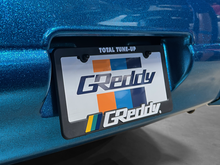 Load image into Gallery viewer, GReddy Total Tune Up License Plate Frame - 3 Color
